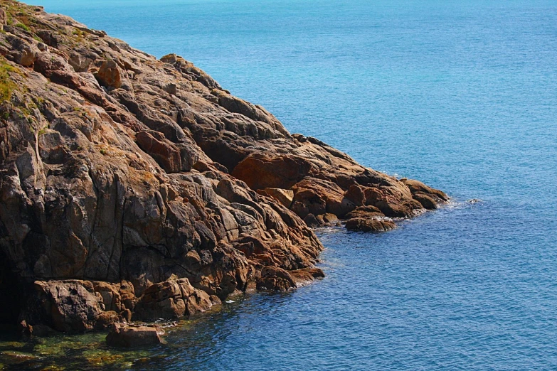 there is a large rock in the water