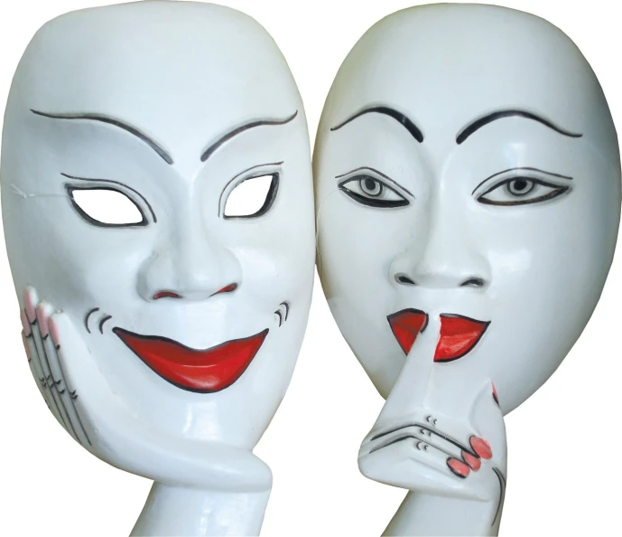 a pair of masks with a woman's face in the middle