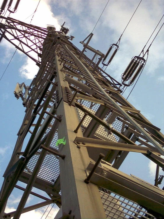 an electrical tower that has wires running along it