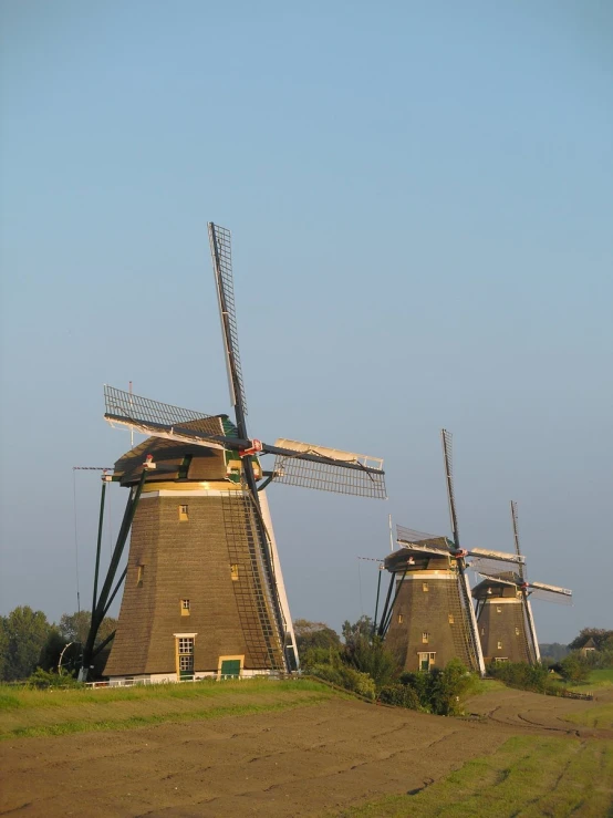 a small group of wind turbines that are next to each other