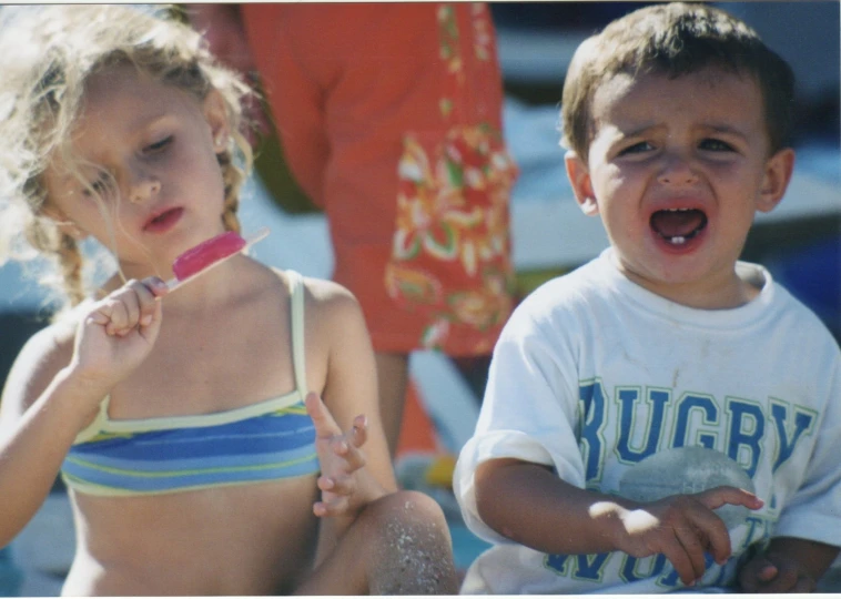 two s sit near each other with their mouths open