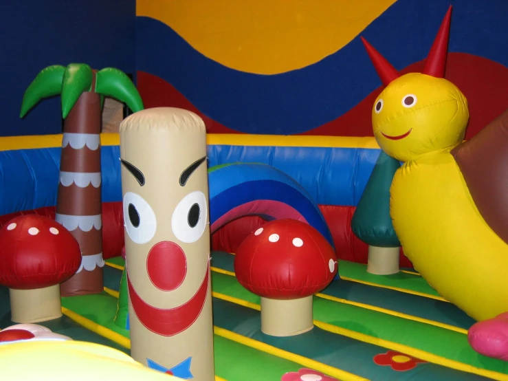 a couple of inflatable mushrooms sitting on top of an inflatable play field