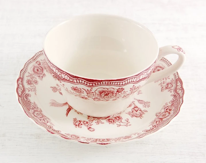 a set of three antique tea cups and saucers