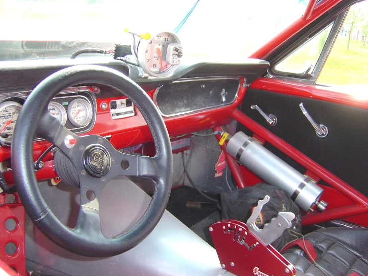 a close up of the steering wheel and interior of a vehicle