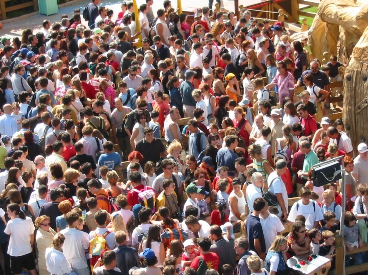 large crowd of people in a city on a sunny day