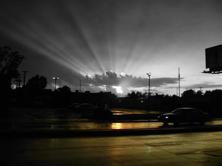 a very black and white po with some street lights