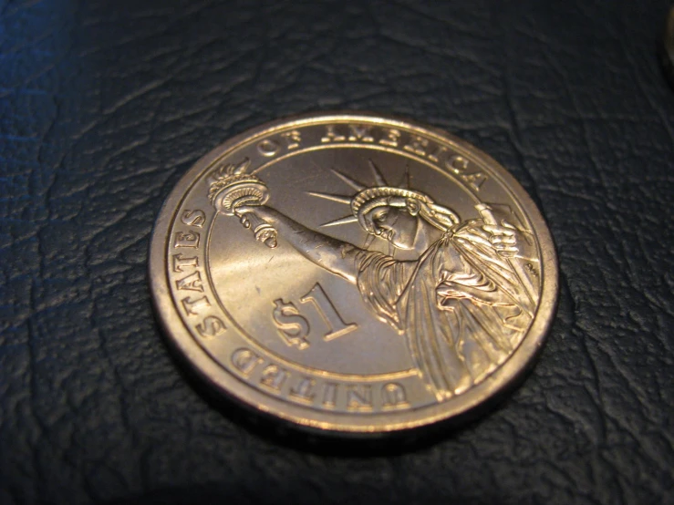 an image of a statue of liberty gold coin