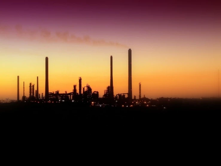 industrial factory silhouette in the evening as seen from an overlook