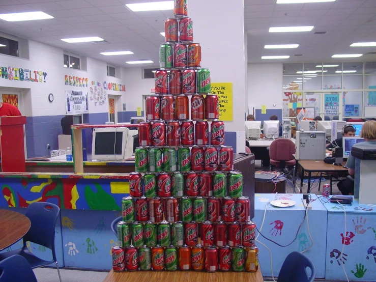 the christmas tree made from cans in a large office