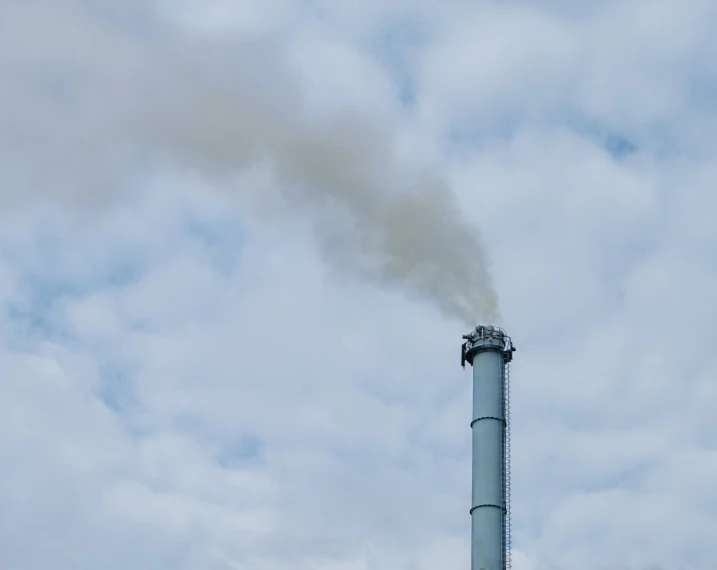 a factory smoke stacks on top of the building