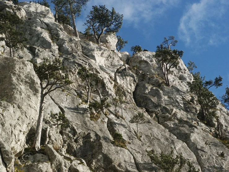 the steep climber is descending near the base of the mountain