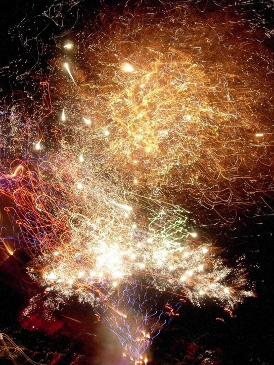 a very large colorful fireworks exploding at night