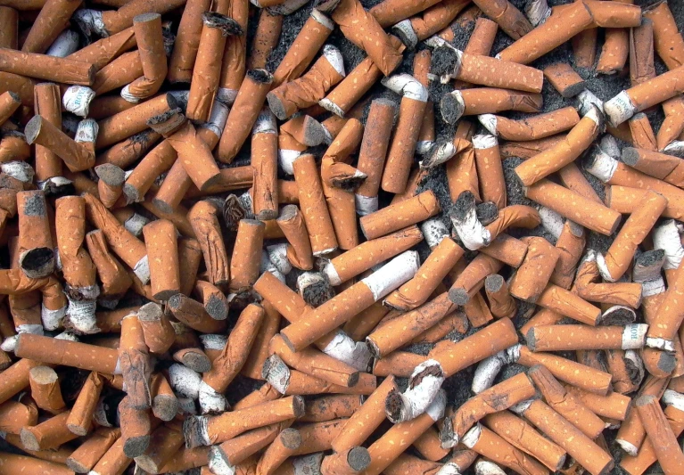 many cigarettes are stacked together in this pile