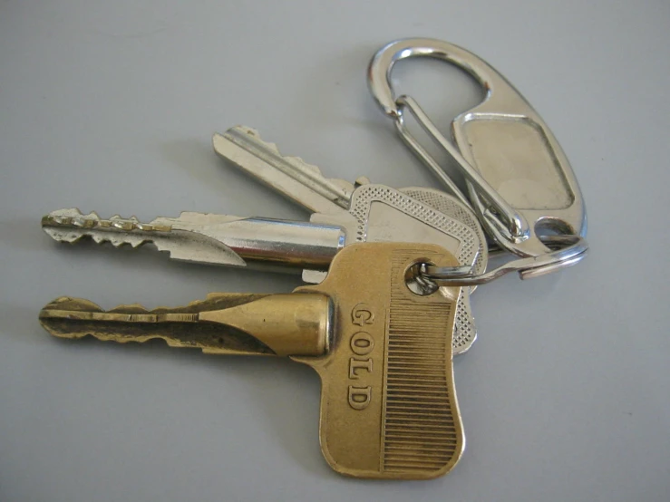 five keys are placed next to each other with each key being attached