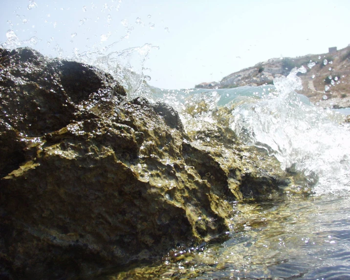 the rocks are made of large stones near the water