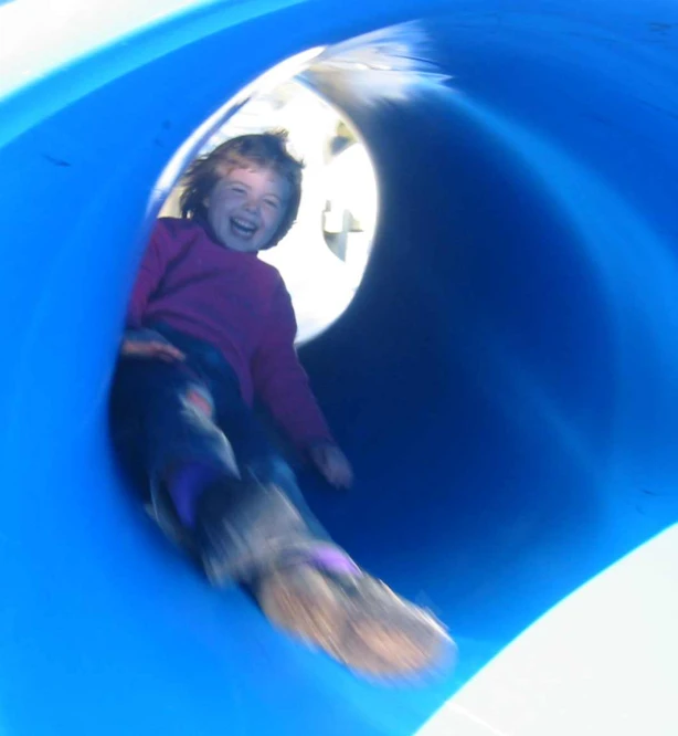 the  is riding in a blue tube