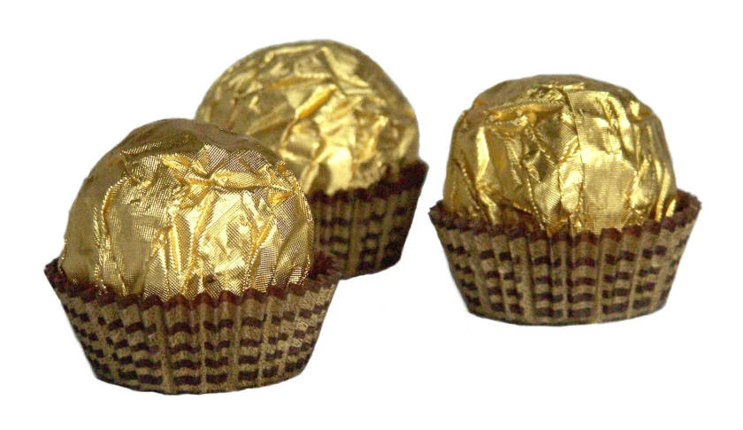 three different sizes of chocolate wrapped in foil