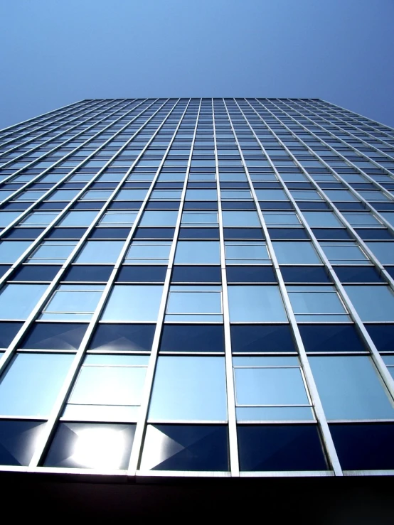 the glass facade of a large office building