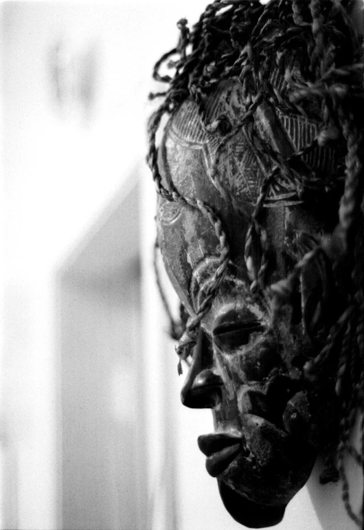black and white pograph of a head on display