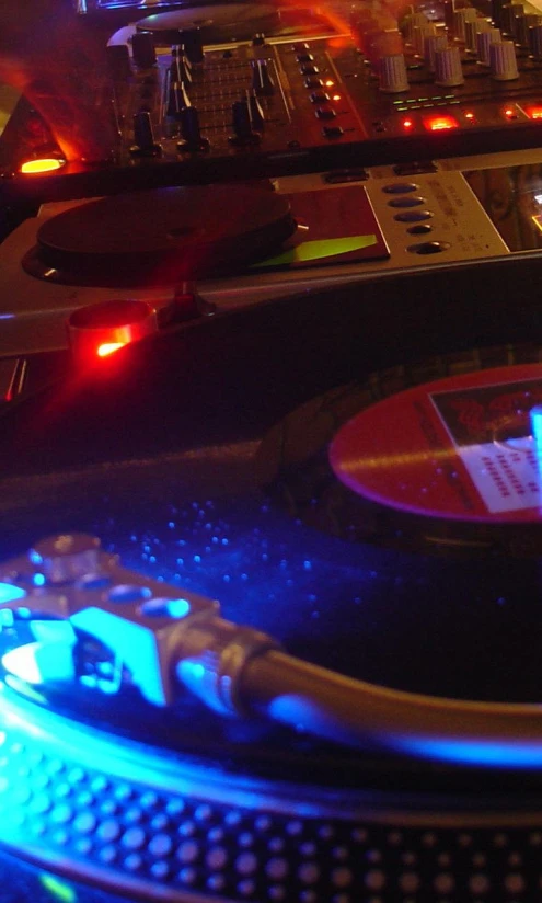 a djs mixes in his studio at night