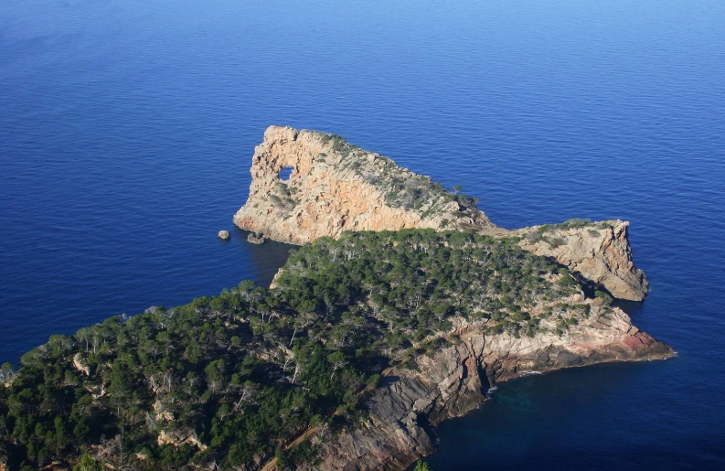 an aerial view of a cliff near the ocean