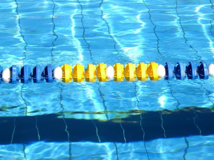 a row of colorful balls in a swimming pool