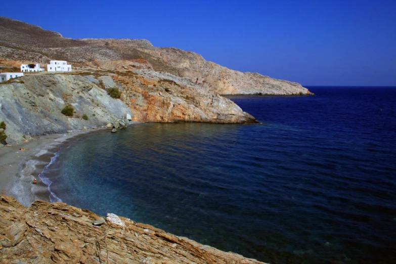 a building on a cliff near the sea