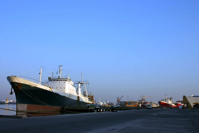 the boats are sitting next to each other in the harbor