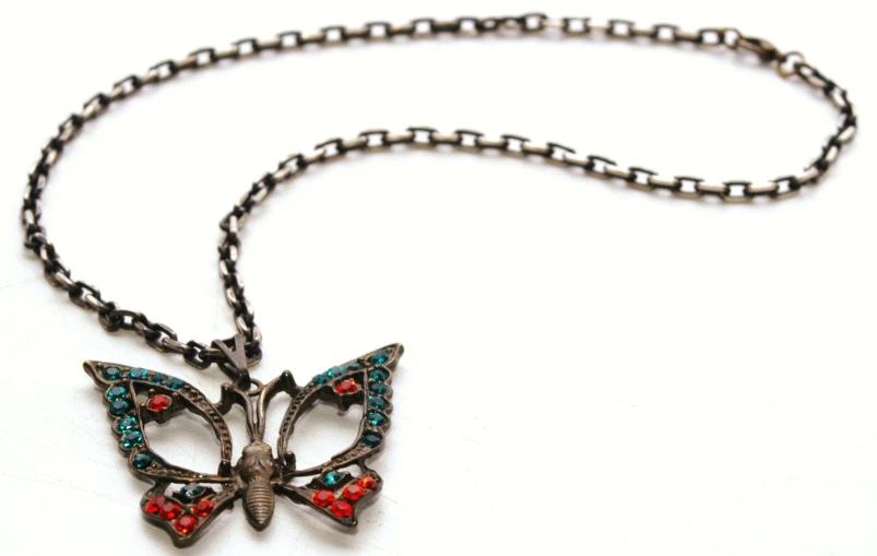 a necklace with red and blue stones on it