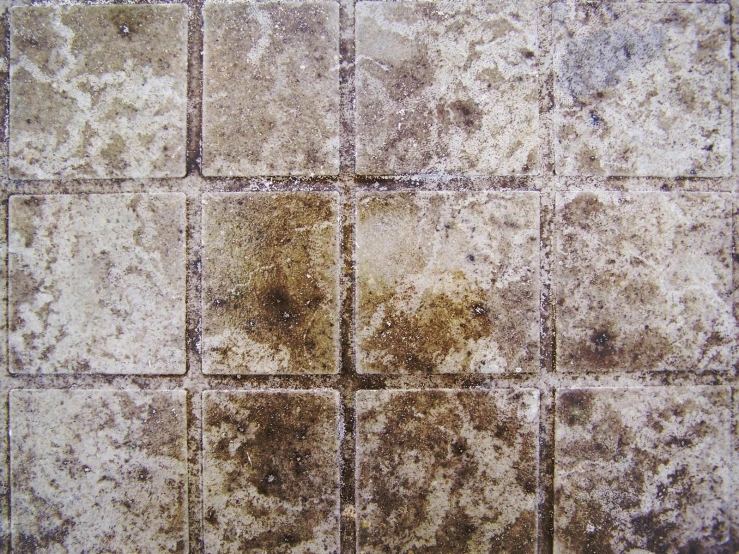textured tile with brown and white tones on a floor