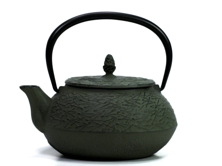 a small clay teapot is seen on display