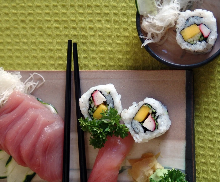 a plate of sushi is shown on a table