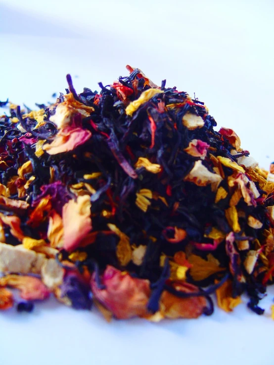 a pile of assorted tea with one tea bag