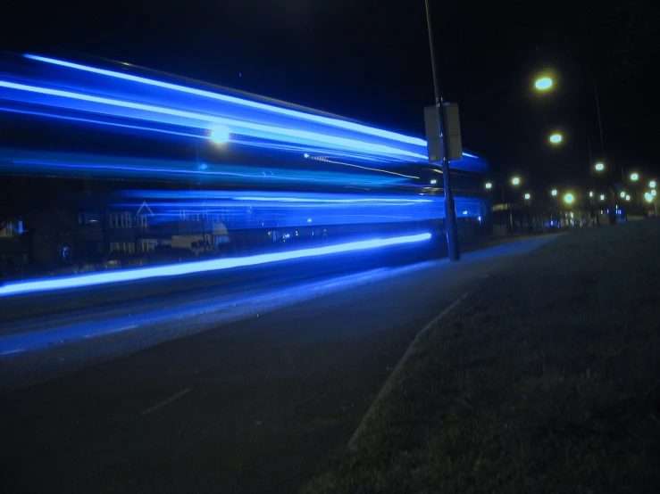 a blurry image of the light on a city street