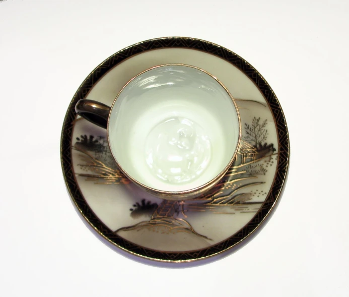 a close up of a cup and saucer