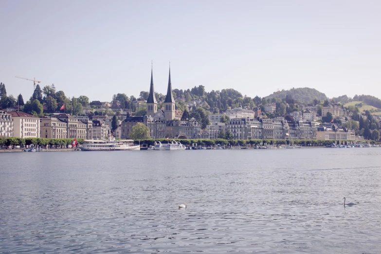 a boat sits on the water near many buildings