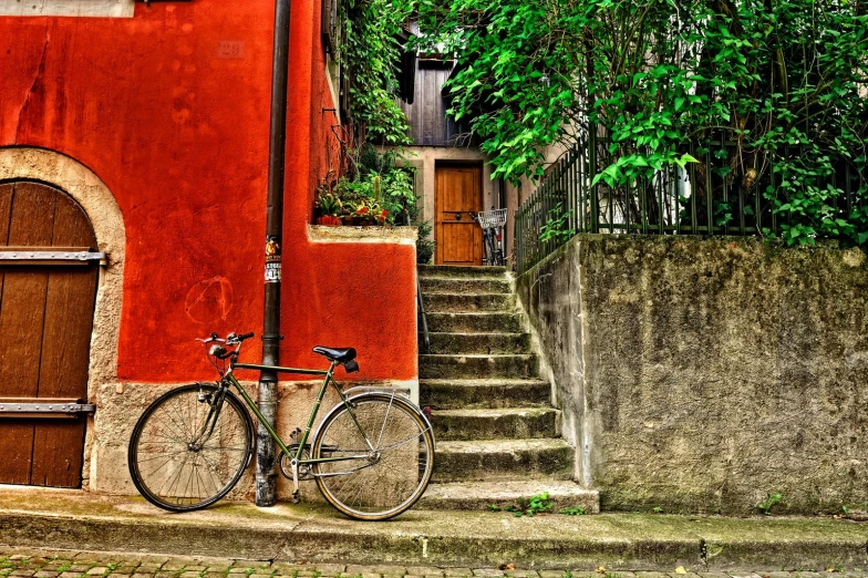 a bike is propped up against the side of a building