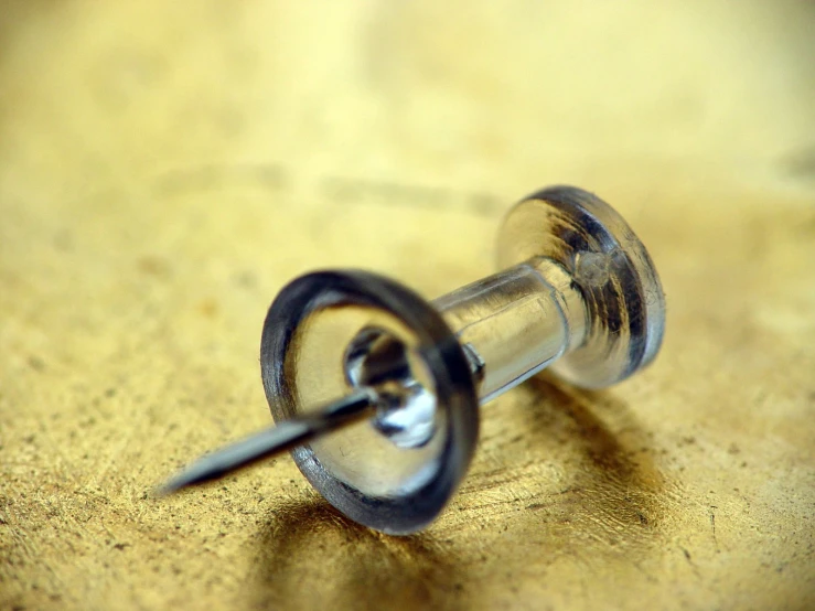 close up of a screw resting in a hole