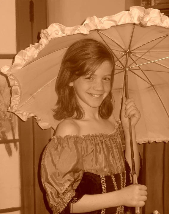 a woman in a dress is holding an umbrella