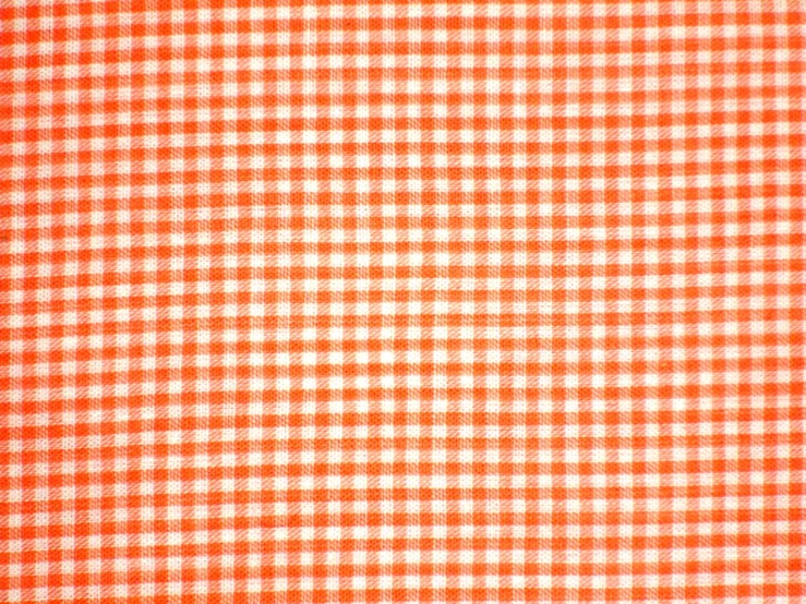 an orange and white checked background with small squares