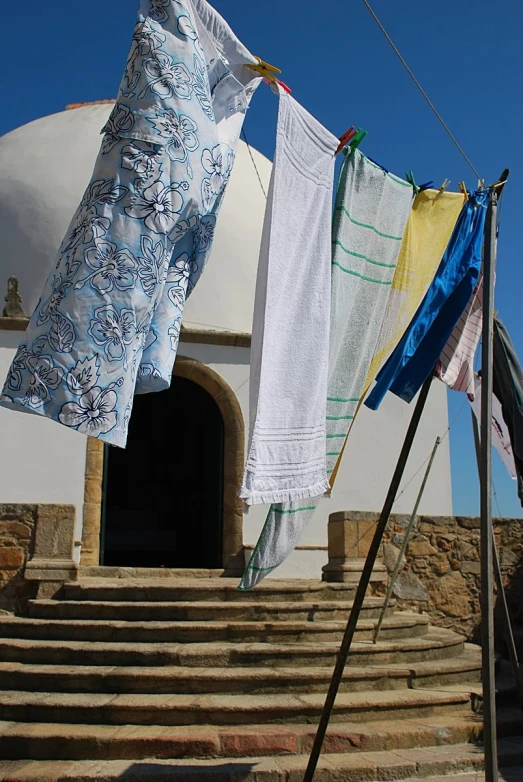 the clothes are hung out to dry outside