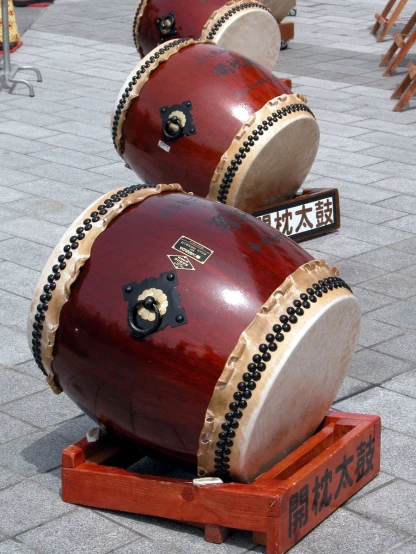 a large pair of drums with words and characters on them
