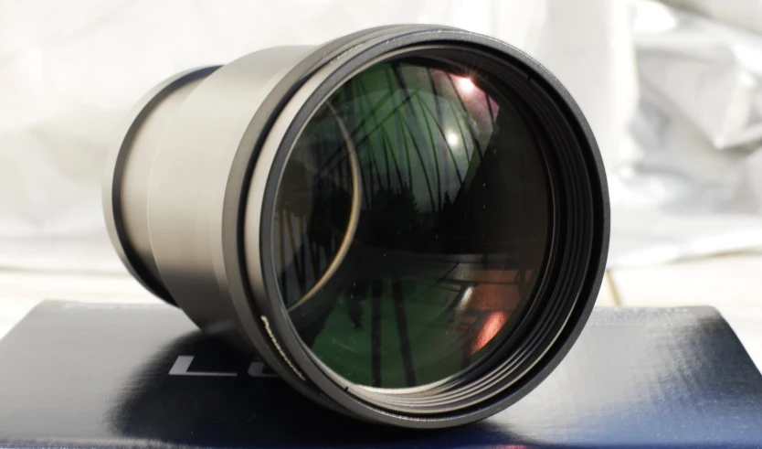 closeup of a lens on a closed book