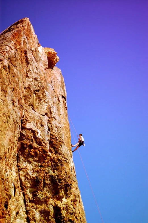 a person that is rapping on a rock