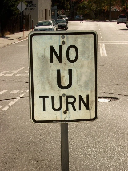 a sign is shown at the corner on a city street