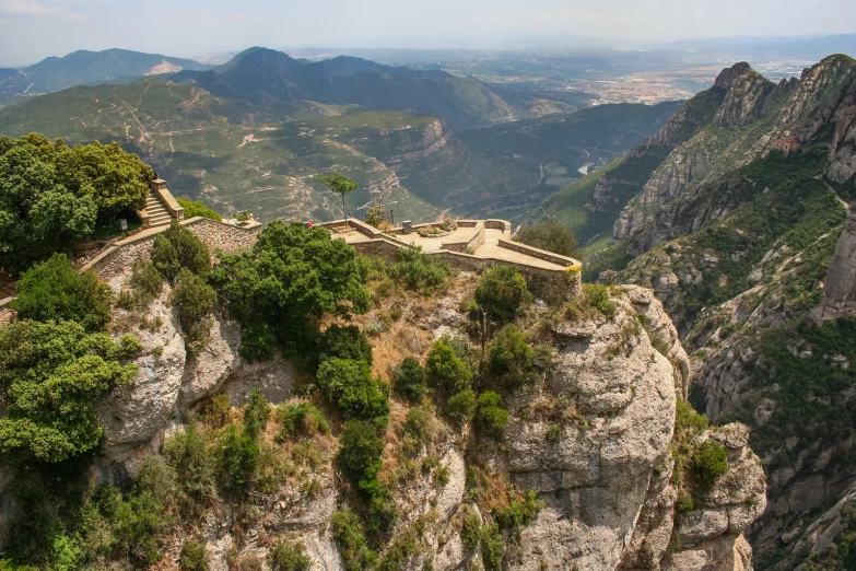 a stone structure at the top of a mountain