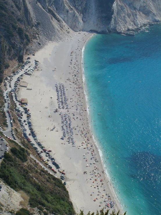 a view of a beach in the mountains and ocean