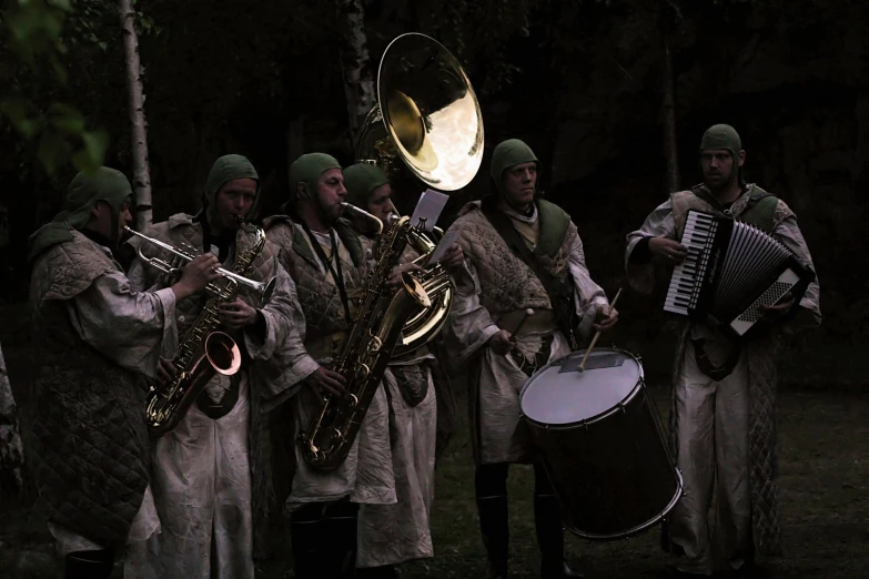 men in medieval garb playing on musical instruments