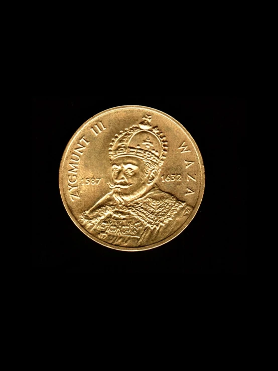 a man's face is shown on this indian coin