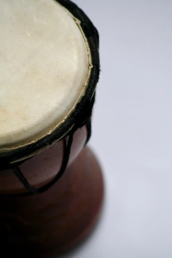 a close up view of an old african drum